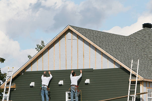 Professional Storm Damage Siding Repair technician working in North Lewisburg, OH